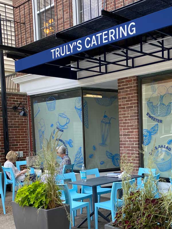 Truly's Catering sign and outdoor seating
